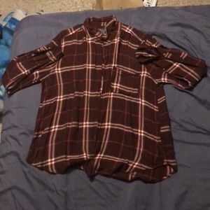 A long sleeved plaid shirt
